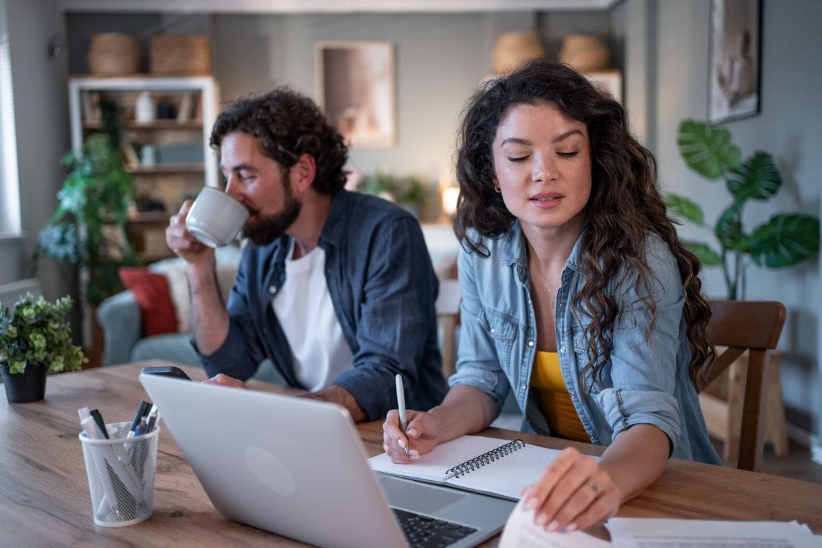 Homebuyers reviewing mortgage loan terms at home