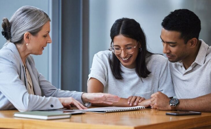 Homebuyers reviewing mortgage loan types with a lender