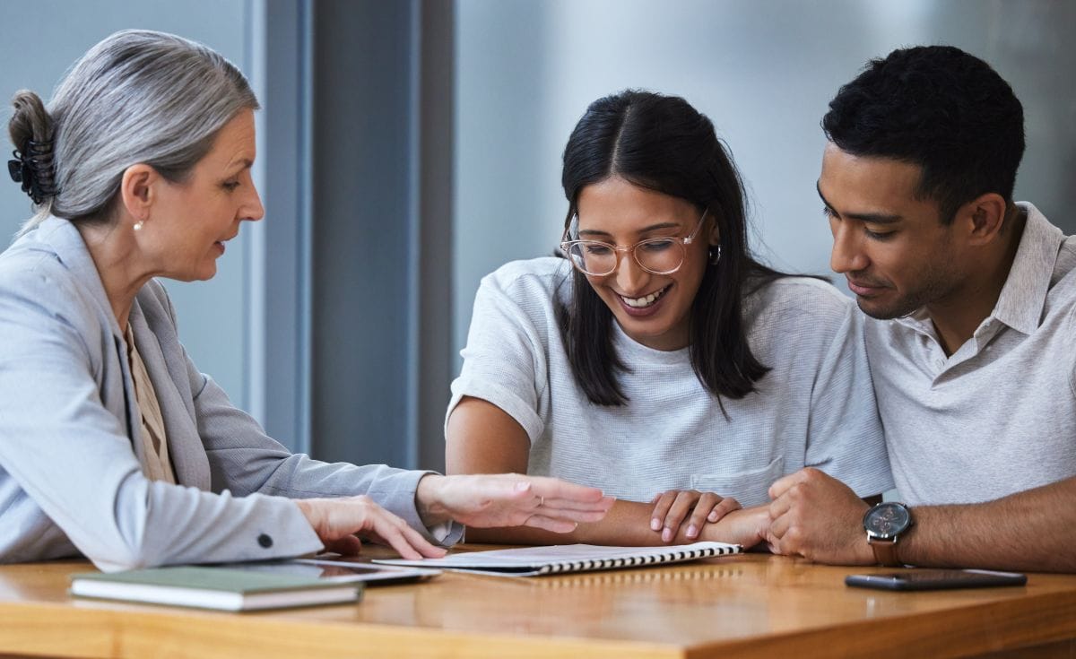 Homebuyers reviewing mortgage loan types with a lender