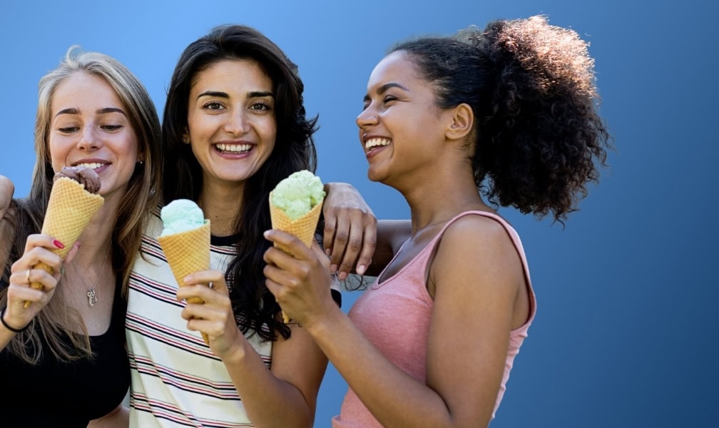 young ladies enjoying ice cream together