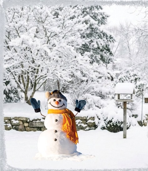 Snowman in a snowy yard seen through a cozy window—bright scarf, raised arms, and winter charm.