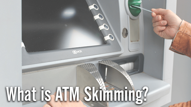 man inserting card into ATM